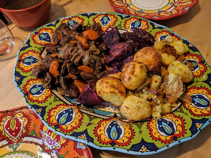 Casseroled lamb with rosemary roast potatoes