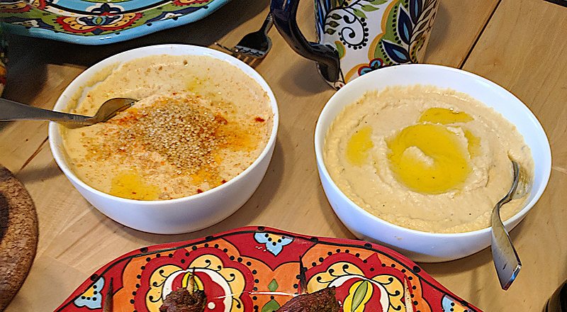 Hummus and a bowl of garnish