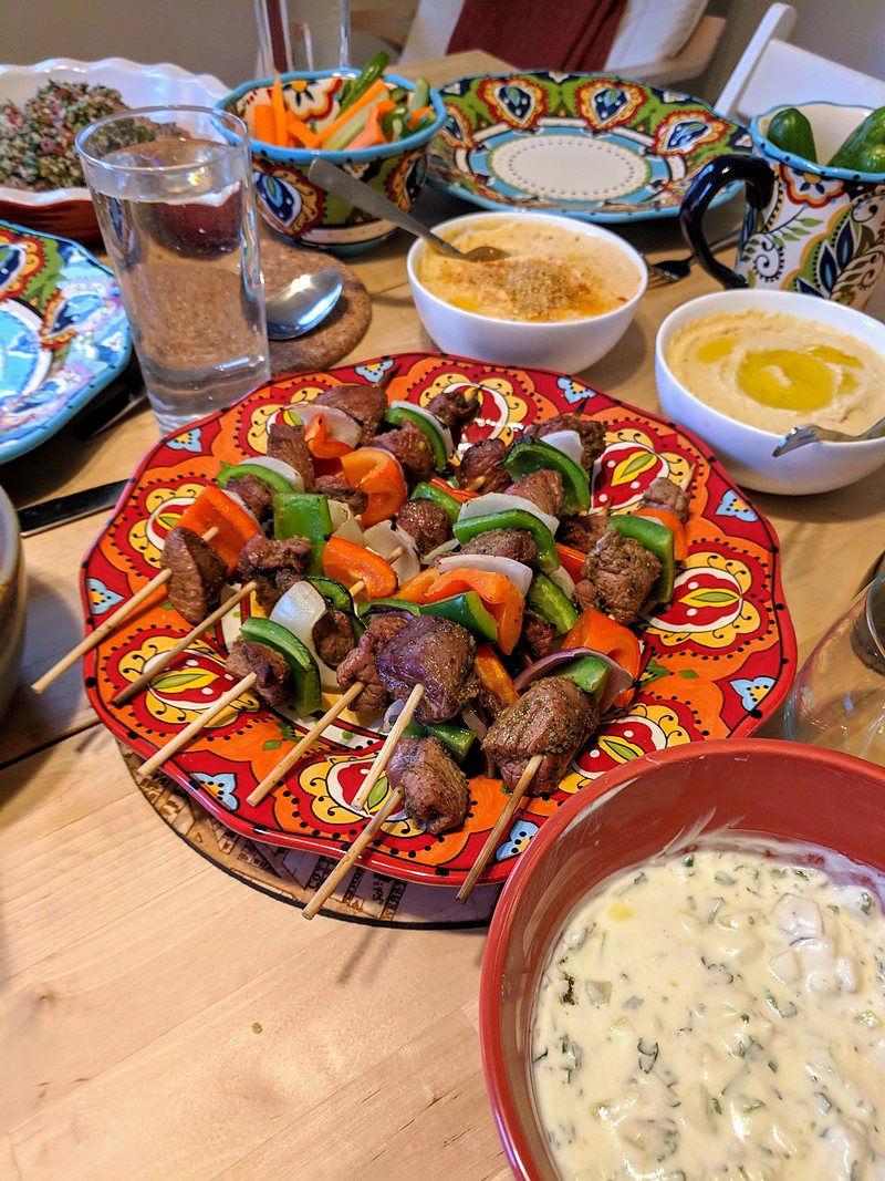 Lamb skewers with rice and salads
