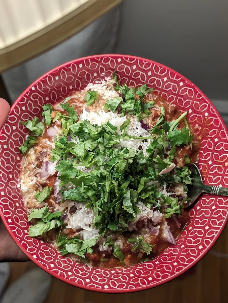 Turkey chili garnished with avocado and cilantro